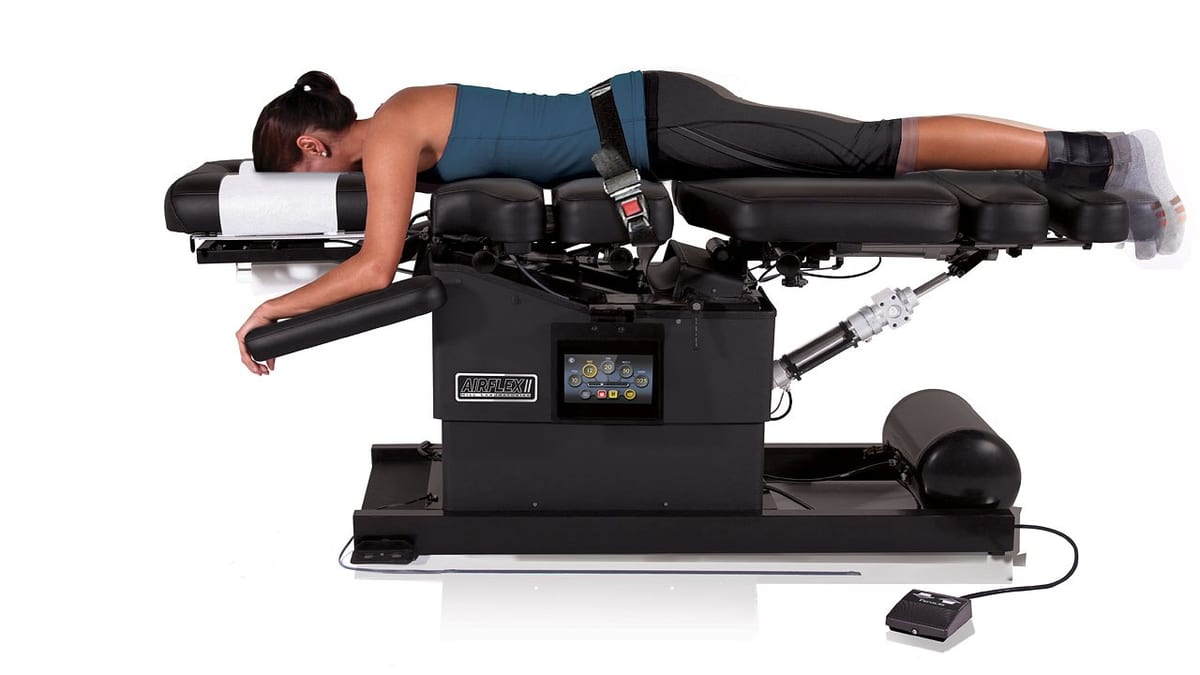 A patient positioned on the Hill AIRFLEX II flexion and distraction table